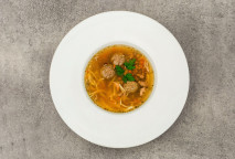 Strong chicken broth with liver dumplings, noodles and vegetables