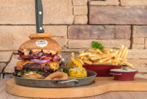CHEESEBURGER veal with Chedar and vegetables, onion rings, corn, French fries