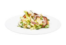 Caesar salad - romaine lettuce with grilled chicken breast, bacon, Parmesan cheese, croutons and dressing